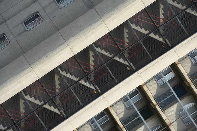 A diagonal view of a building’s staircases. 